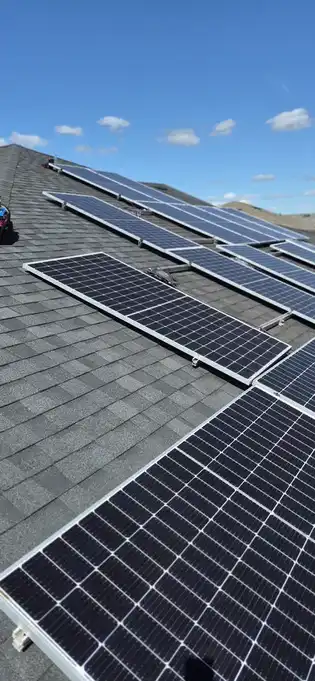 DEPI Solar technician inspecting rooftop panels, Florida