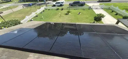 DEPI Solar technician reviewing inverter system, Florida